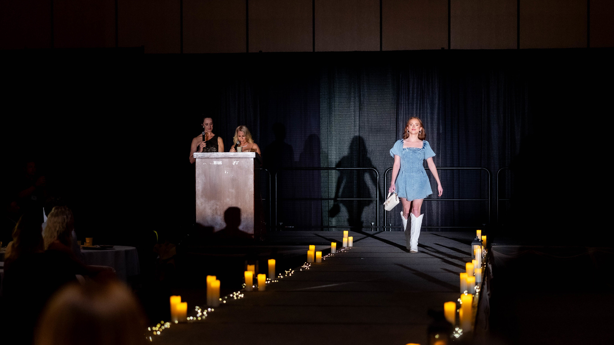 A model walks the runway at the Color Me Kentucky Fashion Show