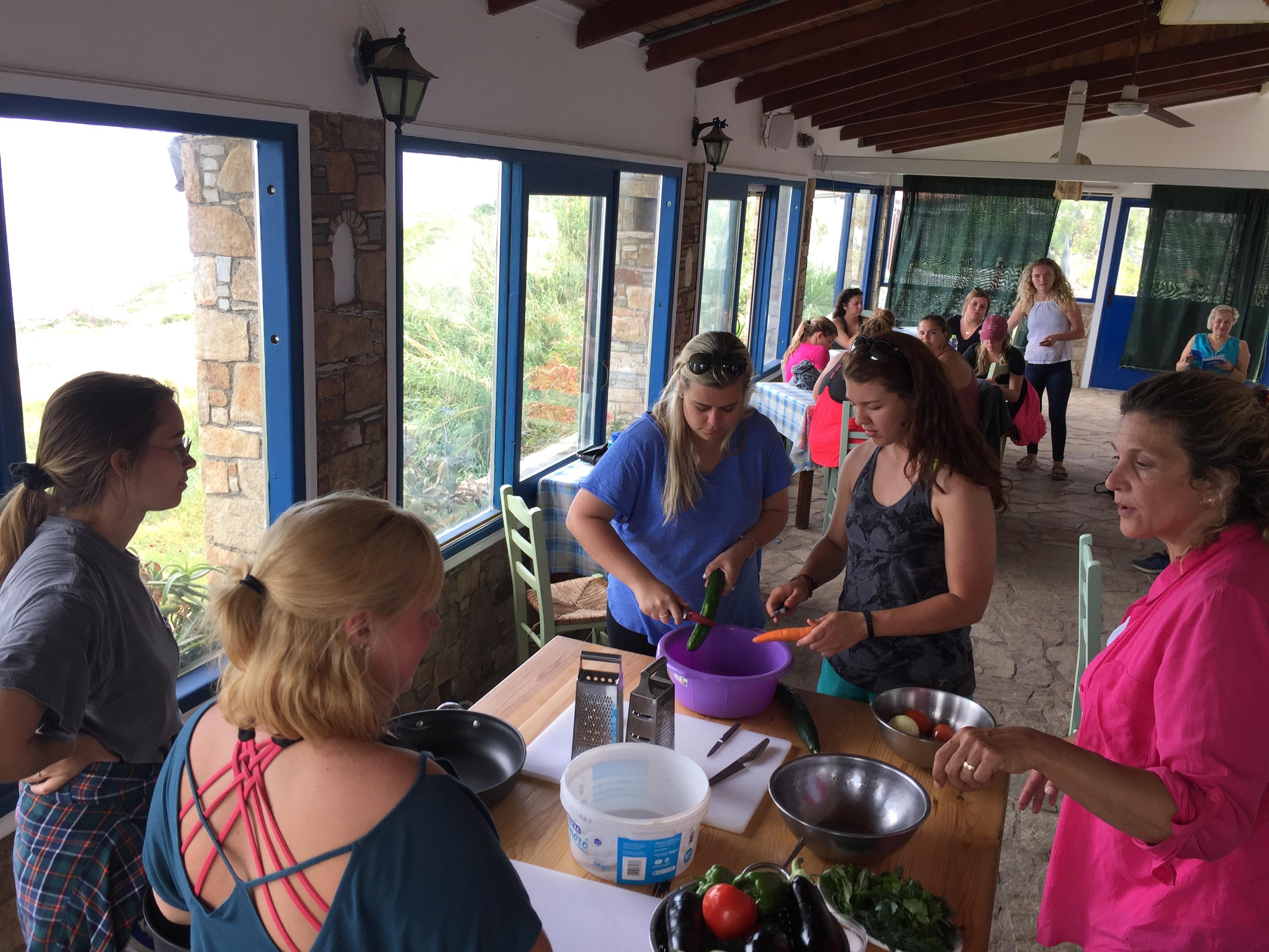 People stand around a table during an education abroad trip